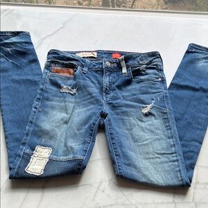 Pilcro and the Letterpress Distressed Patchwork Jeans with Leather Detail.